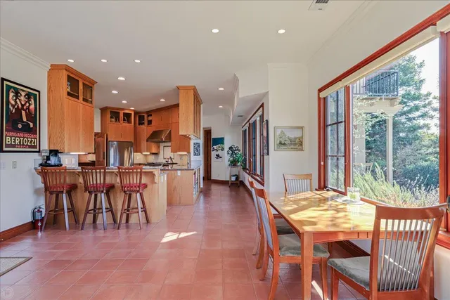 a bedroom with furniture and large windows