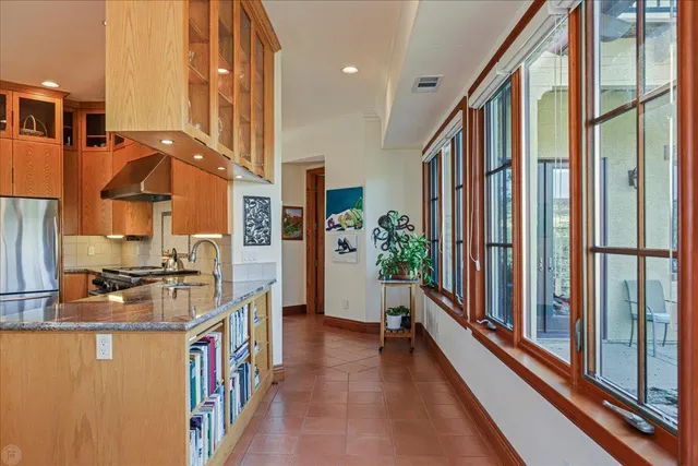 a spacious bathroom with a tub sink shower and a mirror