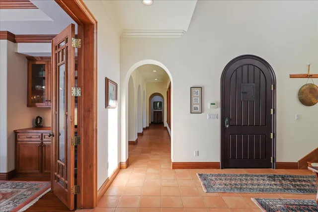 a view of a a dining room with furniture window and wooden floor
