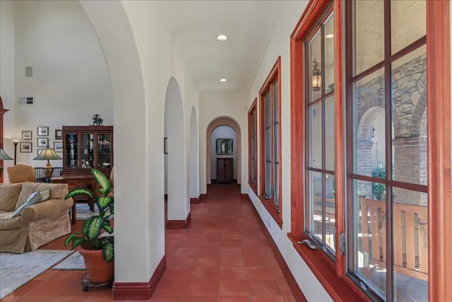 a bathroom with a sink mirror and a shower