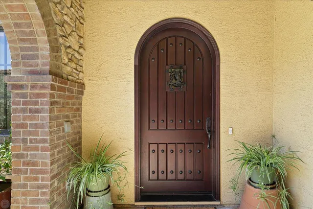 a bed room with a bed and a chandelier