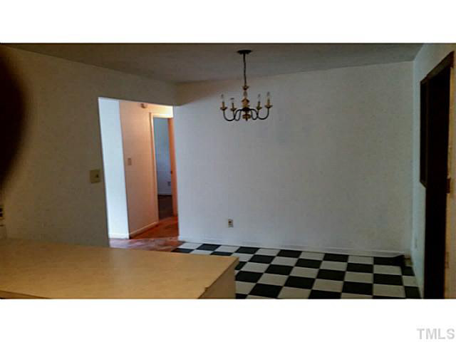 3213 Friar Tuck Road Raleigh, NC 27610 - Photo 3 of 11 a black and white photo of a room