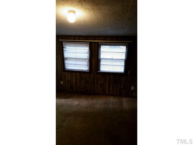 3213 Friar Tuck Road Raleigh, NC 27610 - Photo 5 of 11 a view of a room with a window and a hallway