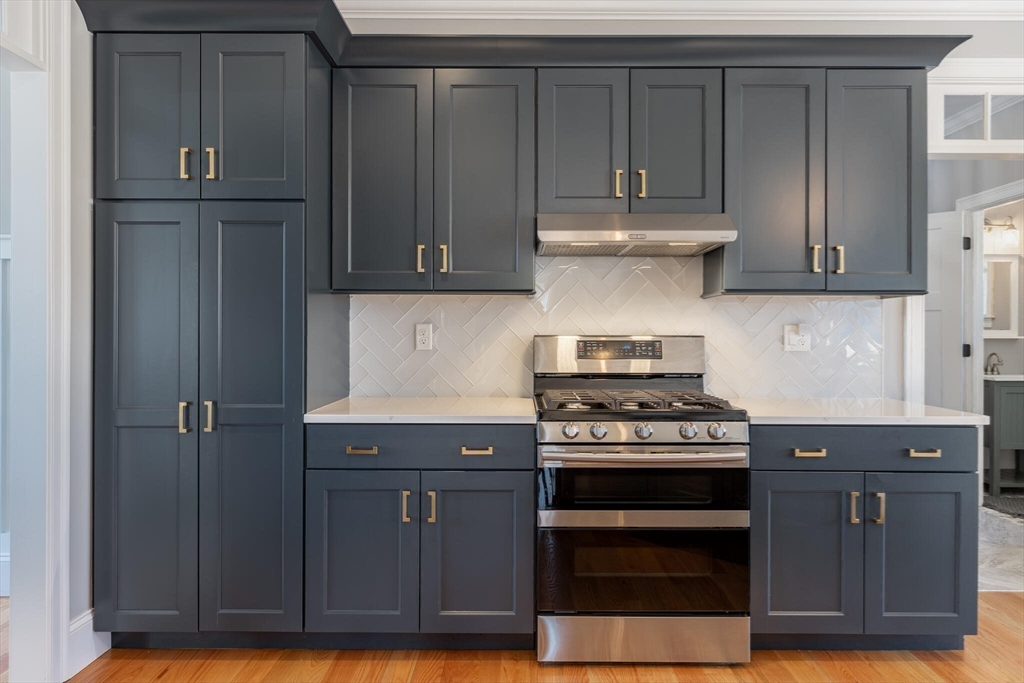 10 Rochambeau Avenue Wrentham, MA 02093 - Photo 13 of 40 a kitchen with granite countertop a stove and a cabinets