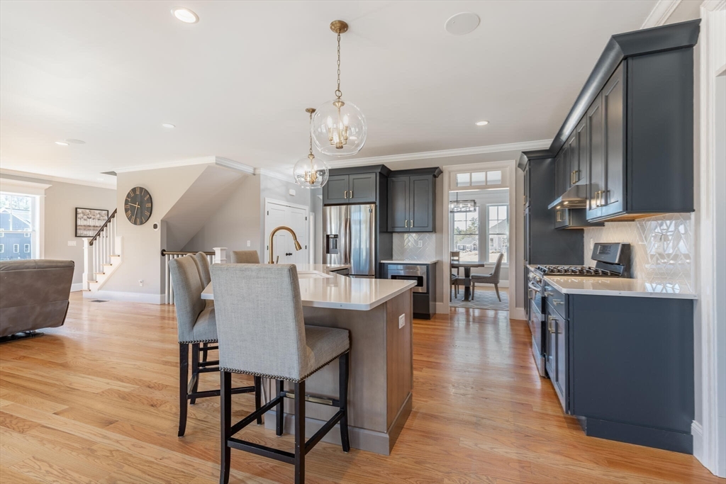 10 Rochambeau Avenue Wrentham, MA 02093 - Photo 14 of 40 a large kitchen with a table and chairs