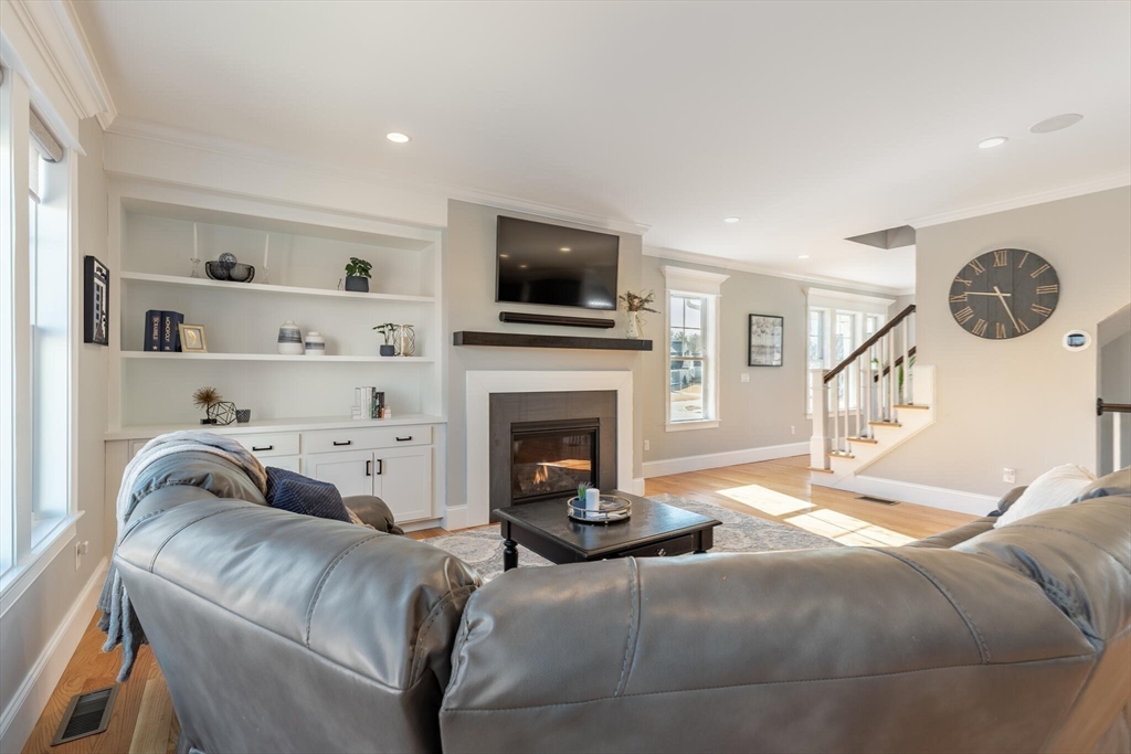 10 Rochambeau Avenue Wrentham, MA 02093 - Photo 18 of 40 a living room with furniture and a flat screen tv