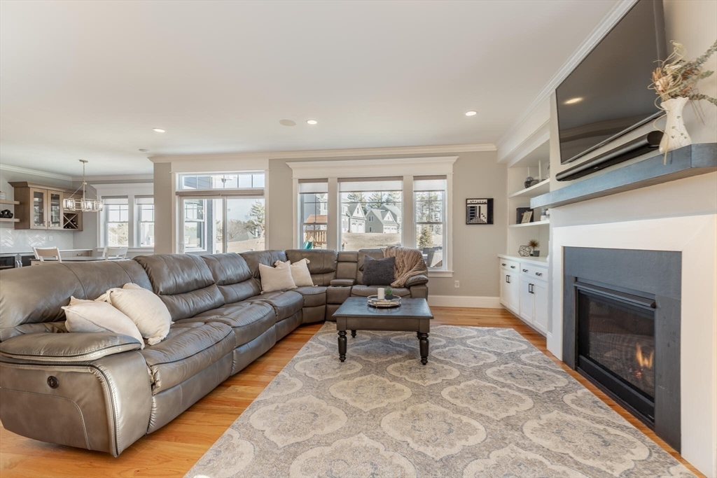 10 Rochambeau Avenue Wrentham, MA 02093 - Photo 20 of 40 a living room with furniture and a fireplace