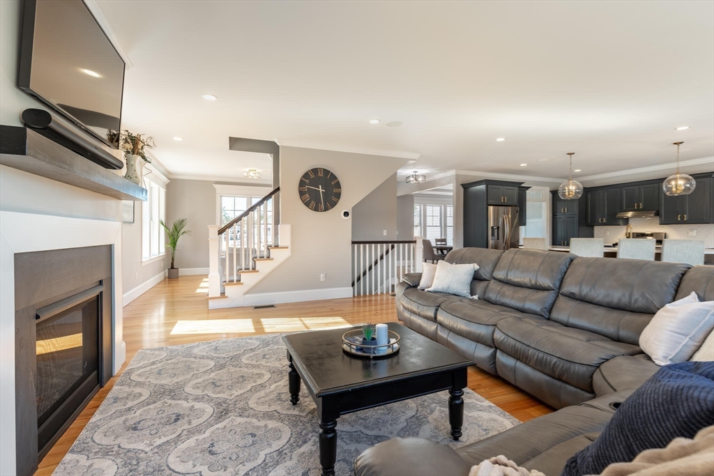 10 Rochambeau Avenue Wrentham, MA 02093 - Photo 22 of 40 a living room with furniture and a fireplace