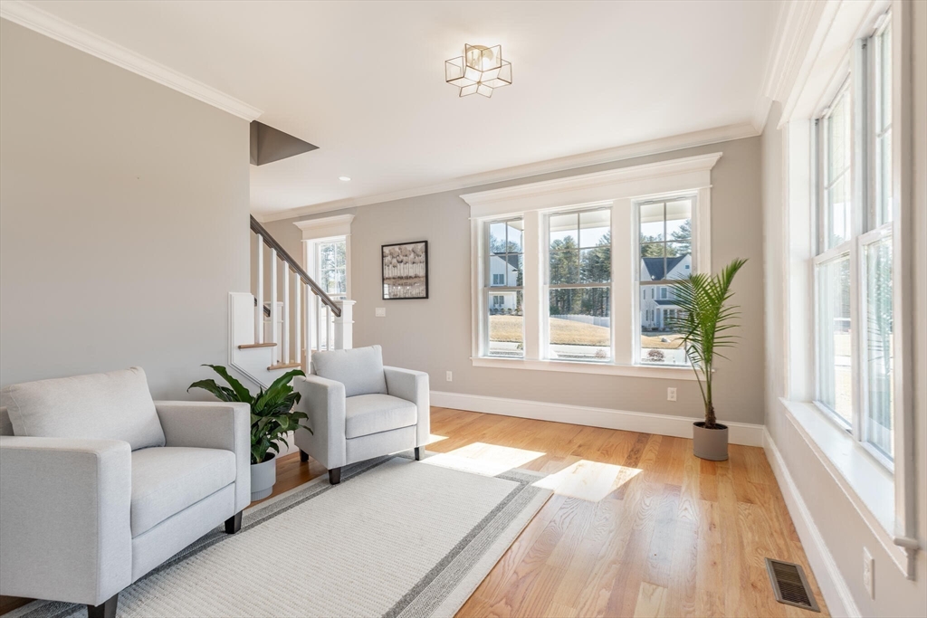 10 Rochambeau Avenue Wrentham, MA 02093 - Photo 23 of 40 a living room with furniture and a large window