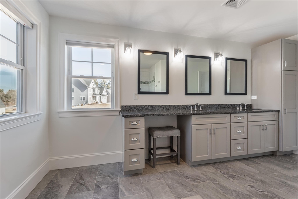 10 Rochambeau Avenue Wrentham, MA 02093 - Photo 28 of 40 a bathroom with double vanity and a mirror