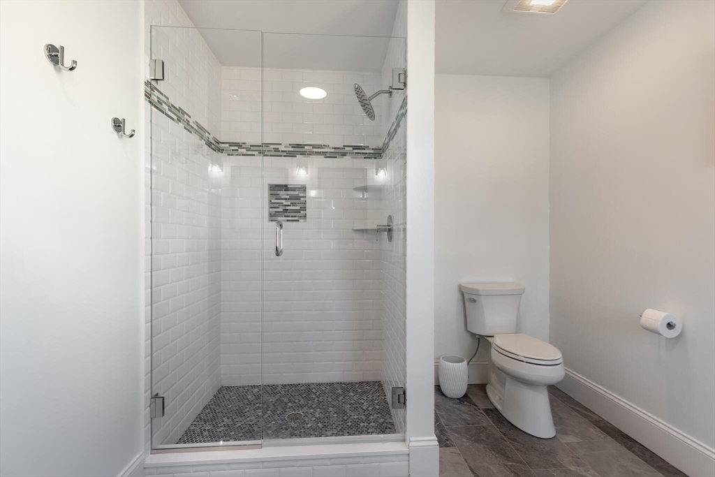 10 Rochambeau Avenue Wrentham, MA 02093 - Photo 29 of 40 a bathroom with a shower and a toilet