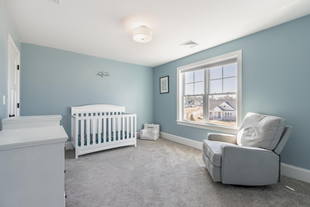 10 Rochambeau Avenue Wrentham, MA 02093 - Photo 32 of 40 a bedroom with furniture and a window