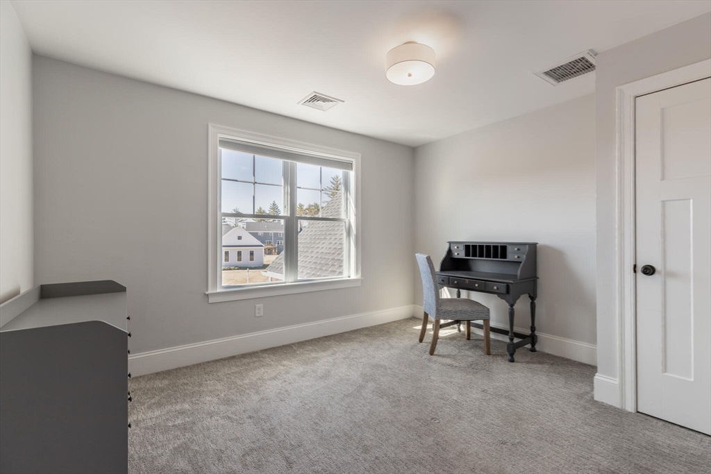 10 Rochambeau Avenue Wrentham, MA 02093 - Photo 33 of 40 a view of a workspace with furniture and a window