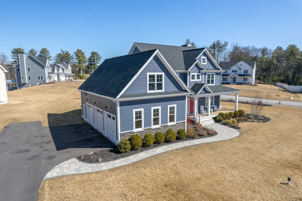 10 Rochambeau Avenue Wrentham, MA 02093 - Photo 37 of 40 a front view of a house with a yard