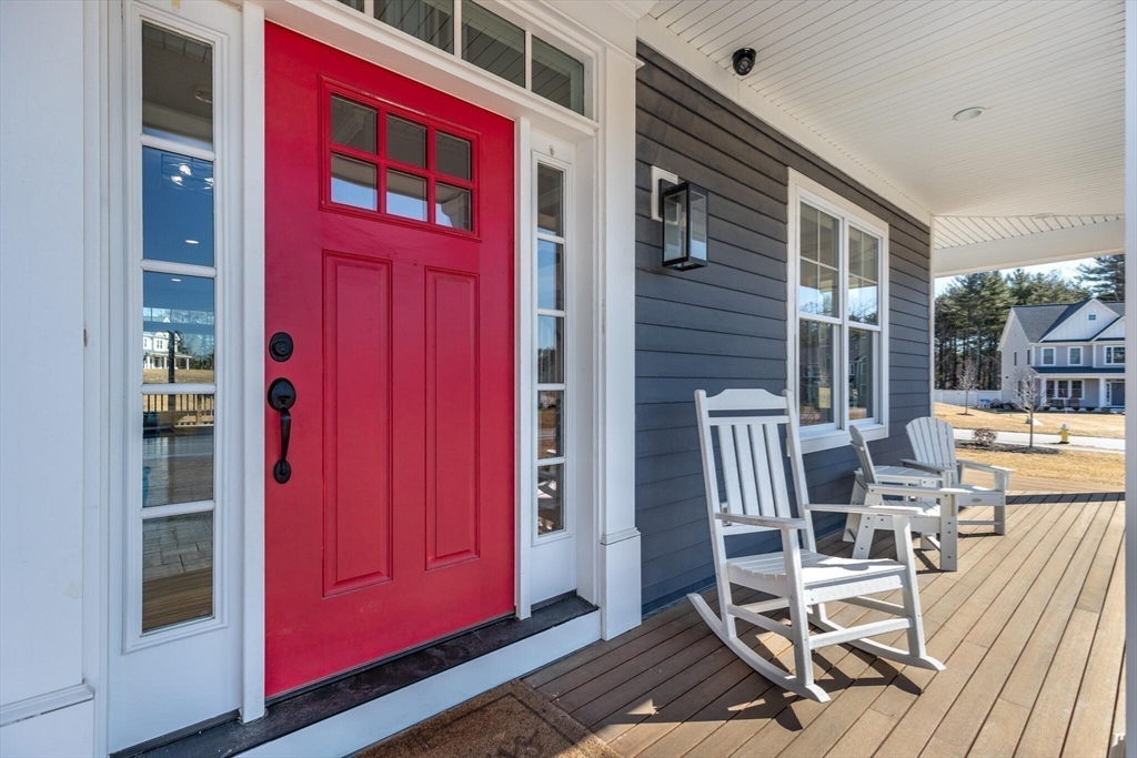 10 Rochambeau Avenue Wrentham, MA 02093 - Photo 5 of 40 a view of a chairs with a red door and chair