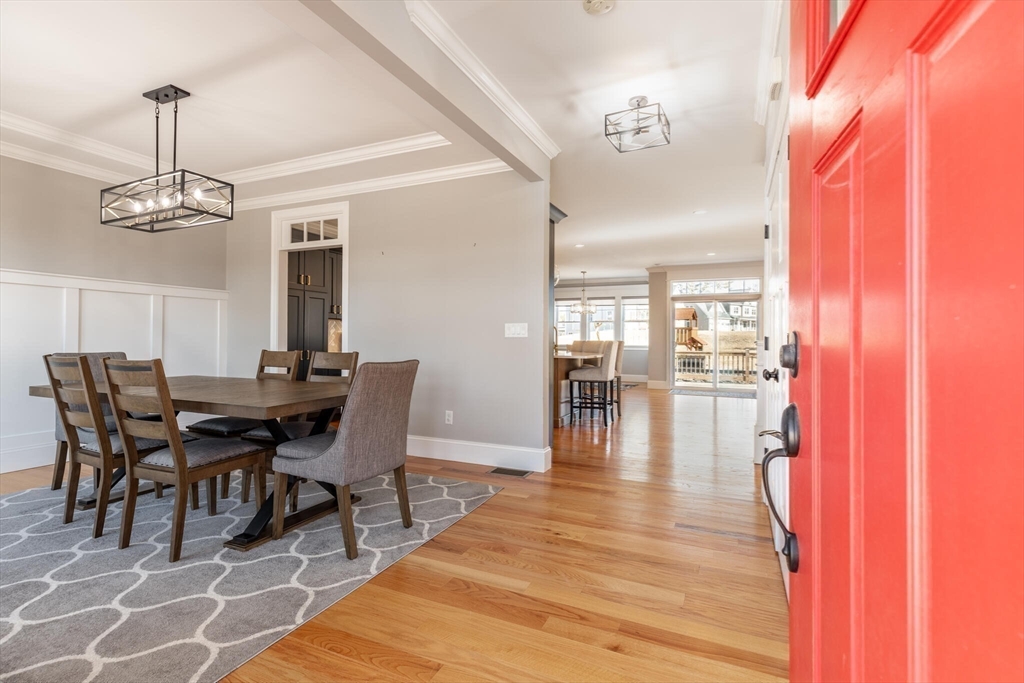 10 Rochambeau Avenue Wrentham, MA 02093 - Photo 6 of 40 a view of a dining room with furniture and wooden floor