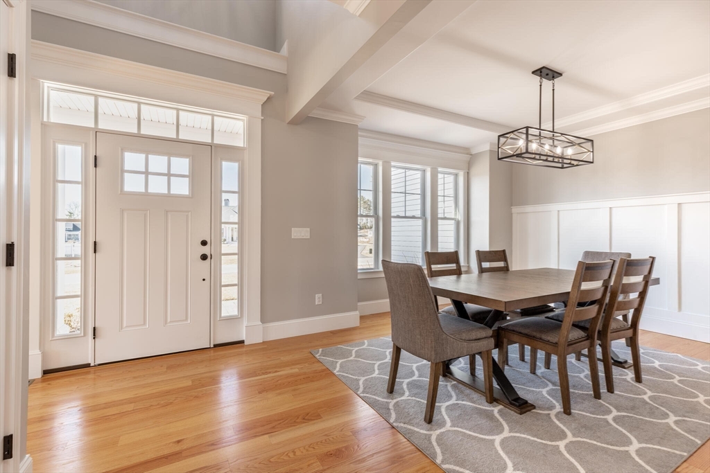 10 Rochambeau Avenue Wrentham, MA 02093 - Photo 7 of 40 a view of a dining room with furniture window and wooden floor