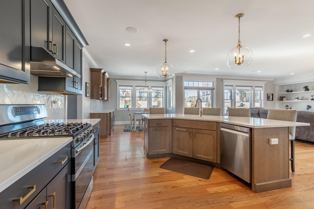 10 Rochambeau Avenue Wrentham, MA 02093 - Photo 10 of 40 a kitchen with stainless steel appliances granite countertop a stove and cabinets