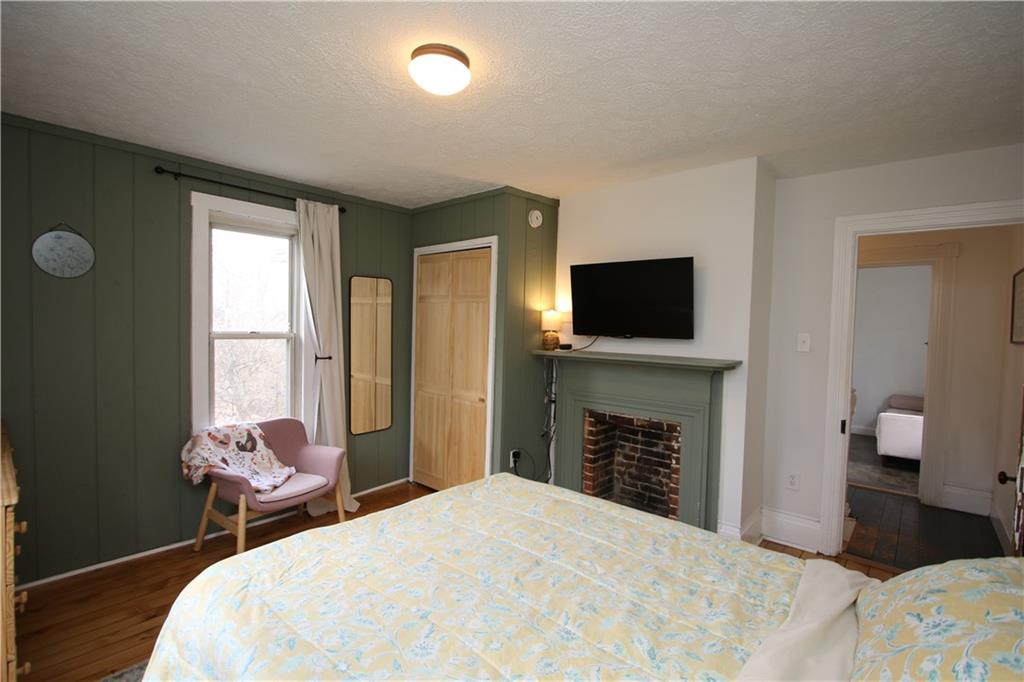 106 Lobbs Run Road Finleyville, PA 15332 - Photo 23 of 50 Original Hardwood Floors & Exposed Brick in Decorative Fireplace in 2nd 13x13 Bedroom
