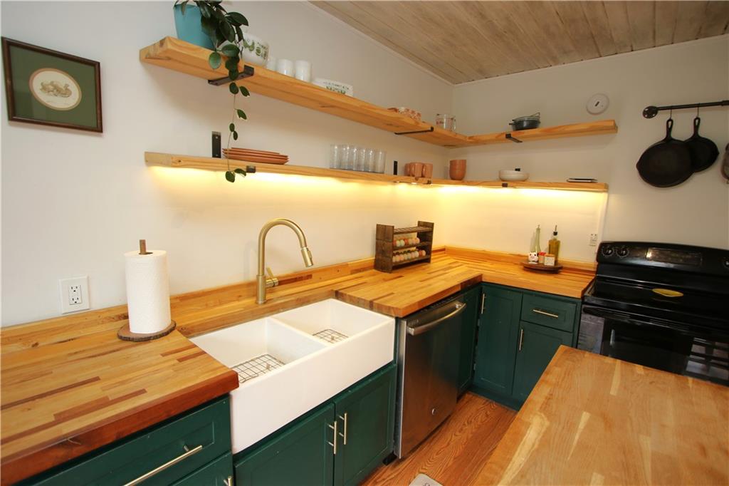 106 Lobbs Run Road Finleyville, PA 15332 - Photo 4 of 50 New Custom Cabinetry, Butcher Block Counters, Attractive Wood Ceilings, Wood Shelving w/ Lighting underneath and Double Bowl Ceramic Farm-Style Sink!
