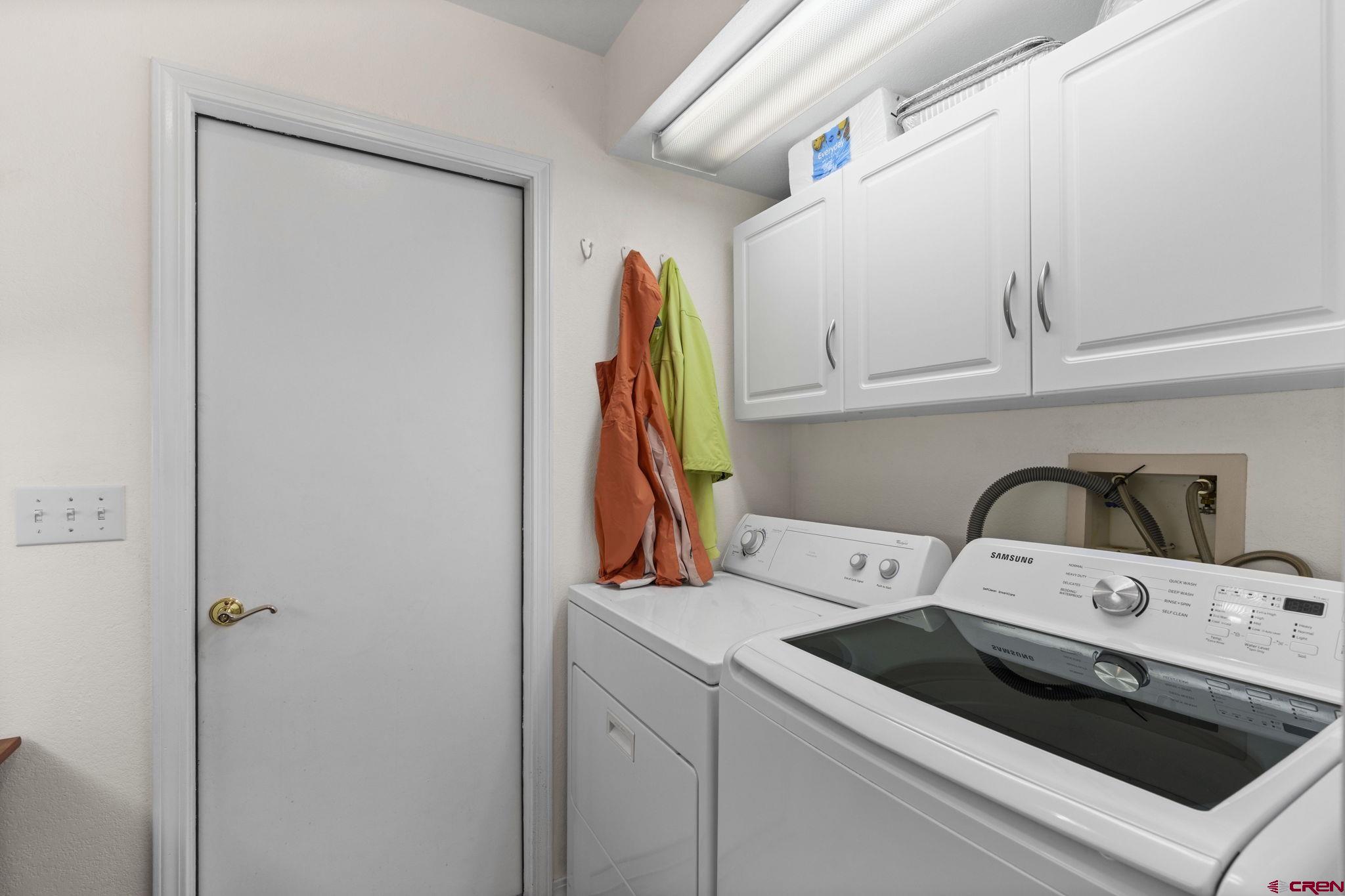 840 Waterfall Lane Durango, CO 81301 - Photo 14 of 31 a utility room with dryer and washer