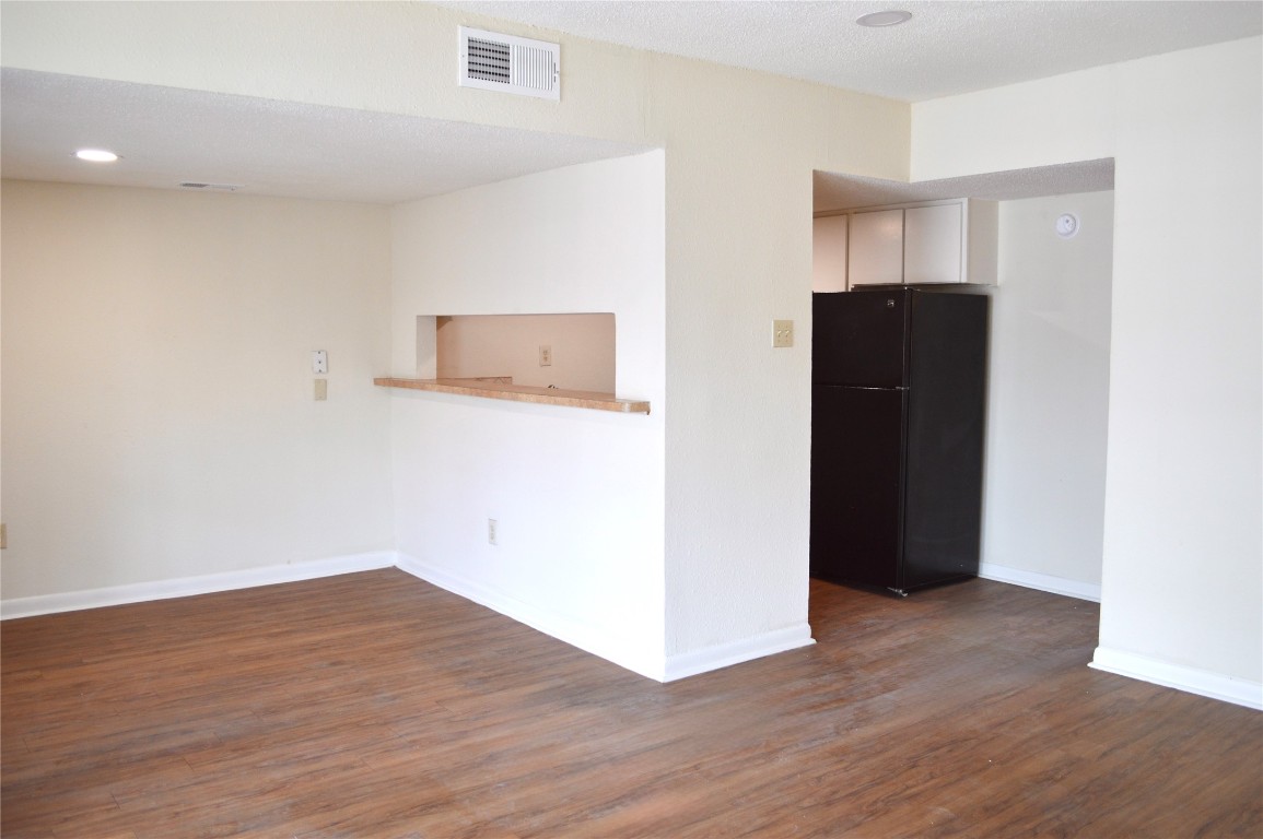 4709 Harmon Avenue, Unit 421 Austin, TX 78751 - Photo 5 of 11 a view of an empty room with wooden floor