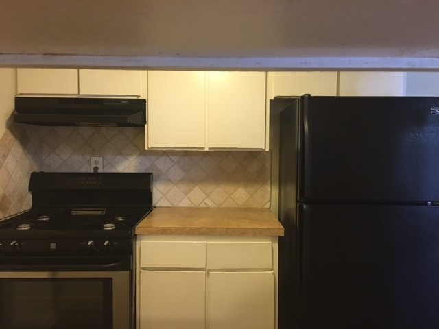 4709 Harmon Avenue, Unit 421 Austin, TX 78751 - Photo 7 of 11 a bathroom with a sink and a mirror