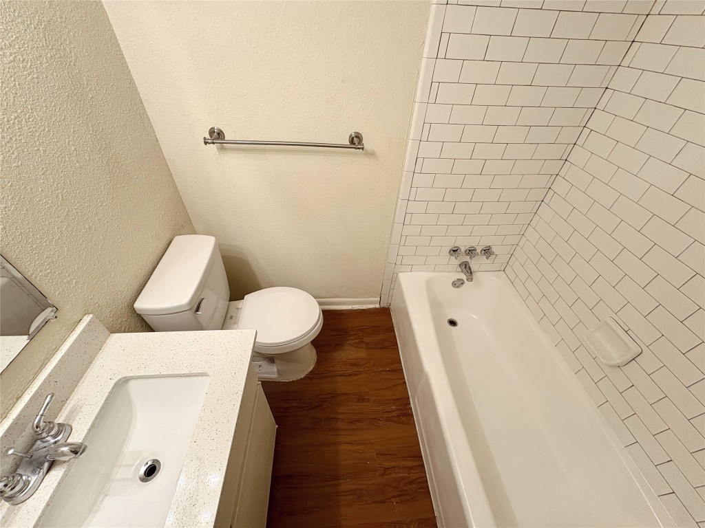 4709 Harmon Avenue, Unit 421 Austin, TX 78751 - Photo 9 of 11 a bathroom with a sink and a toilet