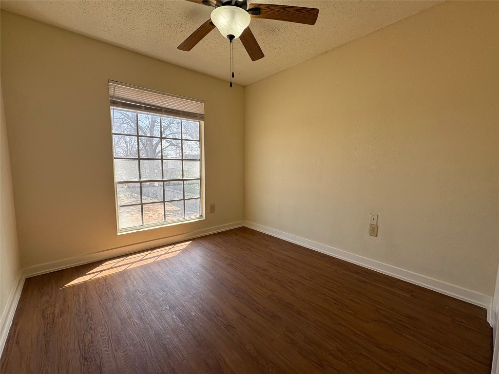 4709 Harmon Avenue, Unit 421 Austin, TX 78751 - Photo 10 of 11 a view of an empty room with wooden floor and a window