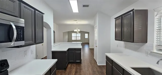 a bathroom with a sink a toilet a mirror and vanity