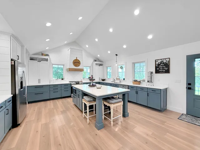 a kitchen with stainless steel appliances a refrigerator and a sink