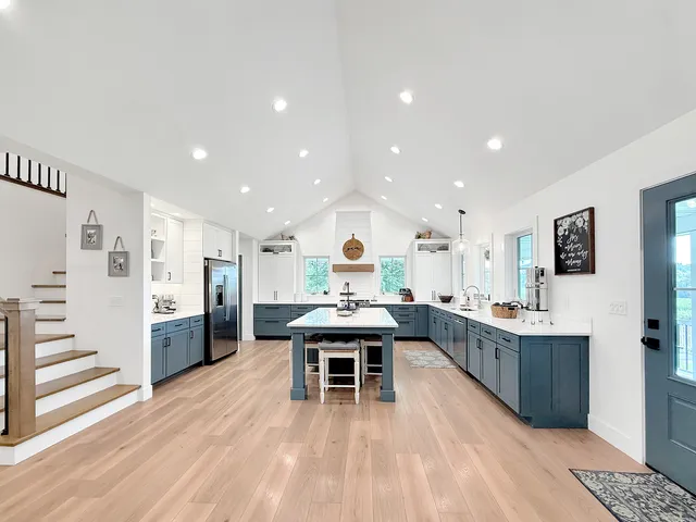 a bed room with a bed window and a flat screen tv