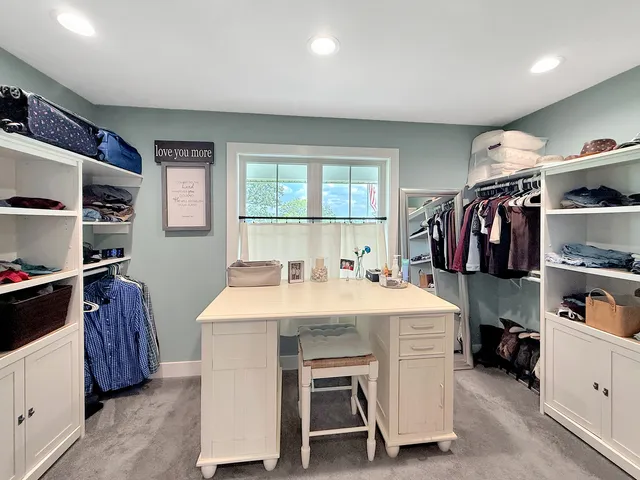 a kitchen with a sink and a large window