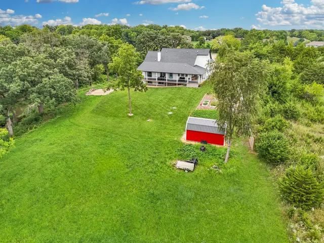 a view of a house with a backyard