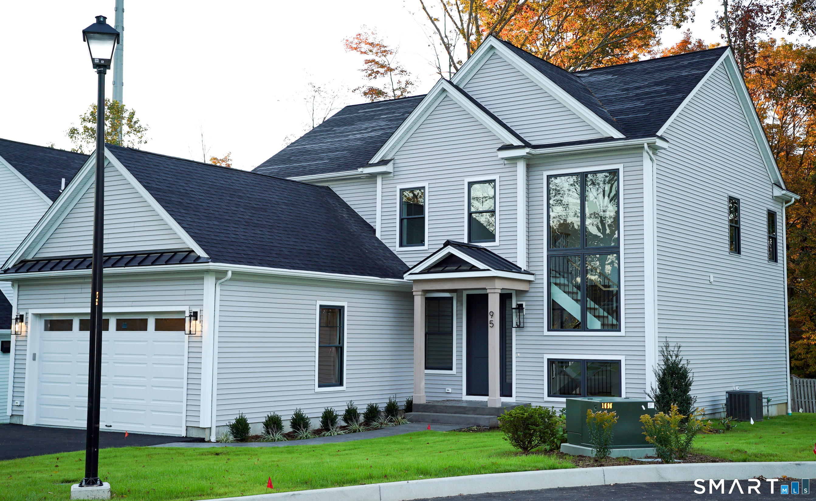 95 Oronoque Lane Stratford, CT 06614 - Photo 1 of 30 a front view of a house with a yard