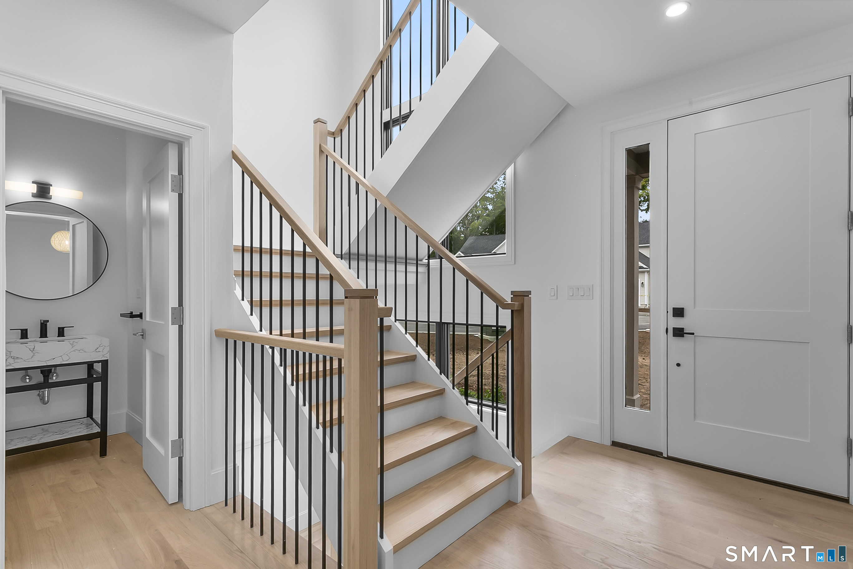 95 Oronoque Lane Stratford, CT 06614 - Photo 15 of 30 a view of entryway and hall with wooden floor