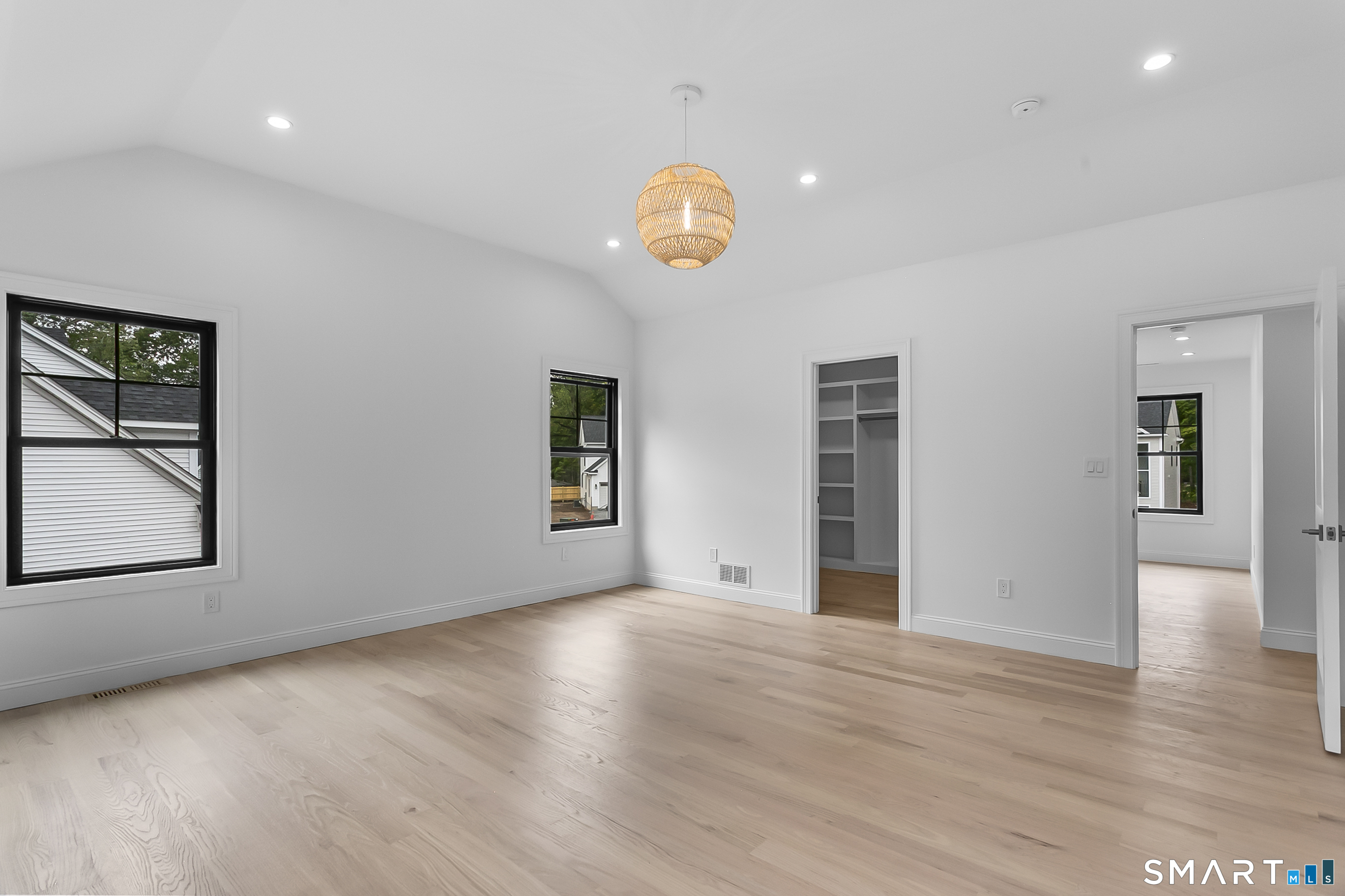 95 Oronoque Lane Stratford, CT 06614 - Photo 17 of 30 an empty room with wooden floor and windows