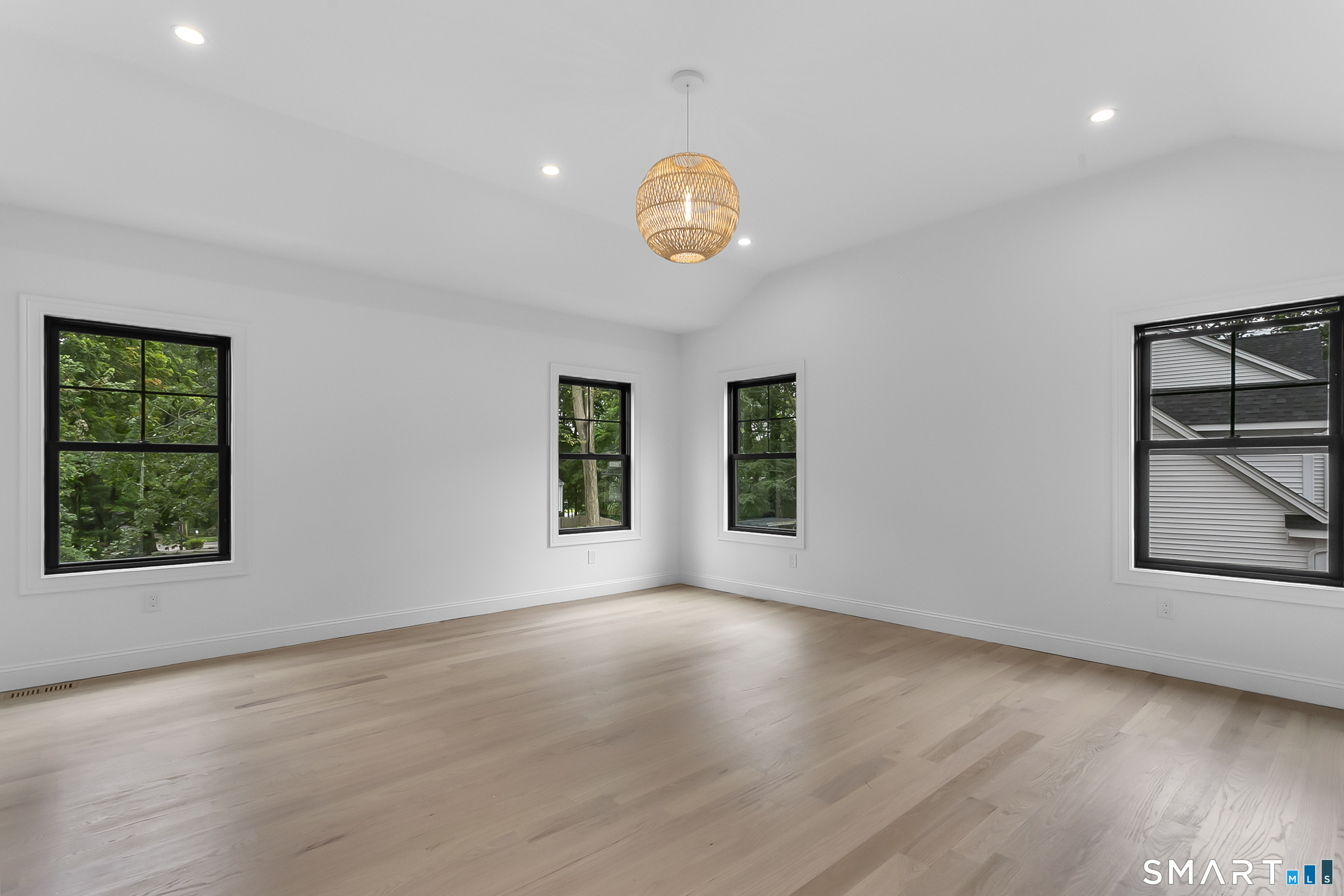 95 Oronoque Lane Stratford, CT 06614 - Photo 18 of 30 a view of an empty room with a window and wooden floor