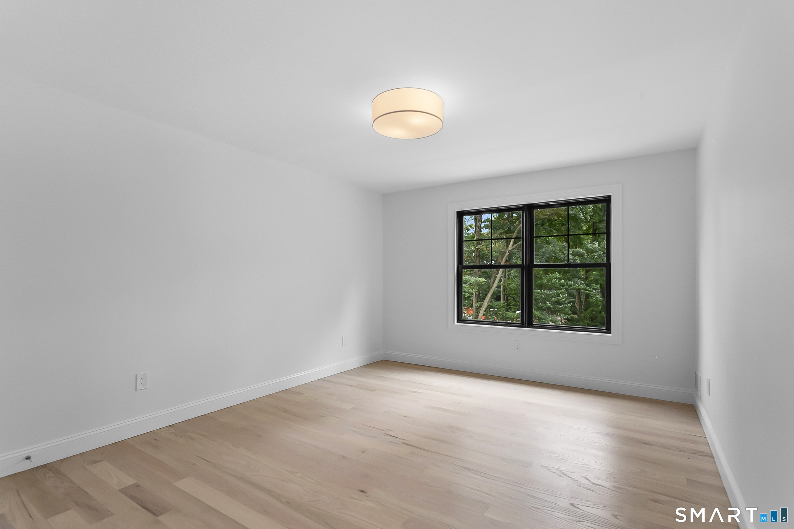 95 Oronoque Lane Stratford, CT 06614 - Photo 27 of 30 an empty room with a window