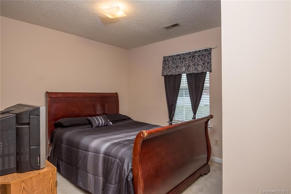 3821 Rosedown Drive Matthews, NC 28105 - Photo 11 of 19 a bedroom with a bed and window