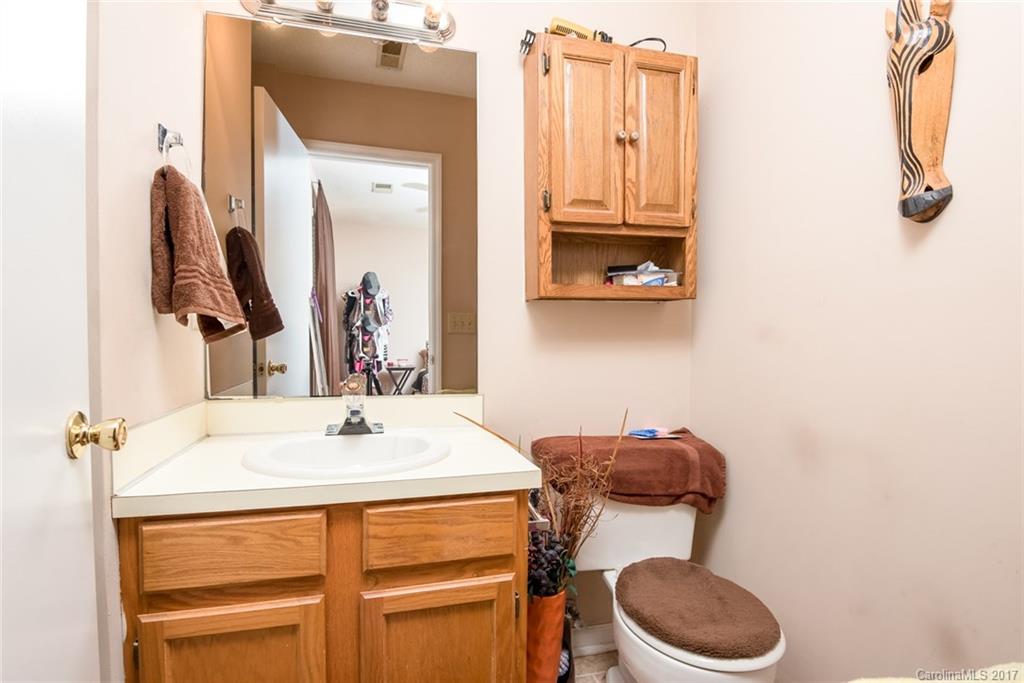 3821 Rosedown Drive Matthews, NC 28105 - Photo 13 of 19 a bathroom with a toilet sink and mirror