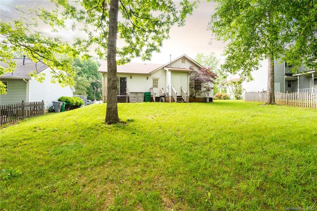 3821 Rosedown Drive Matthews, NC 28105 - Photo 15 of 19 a front view of house with yard and green space