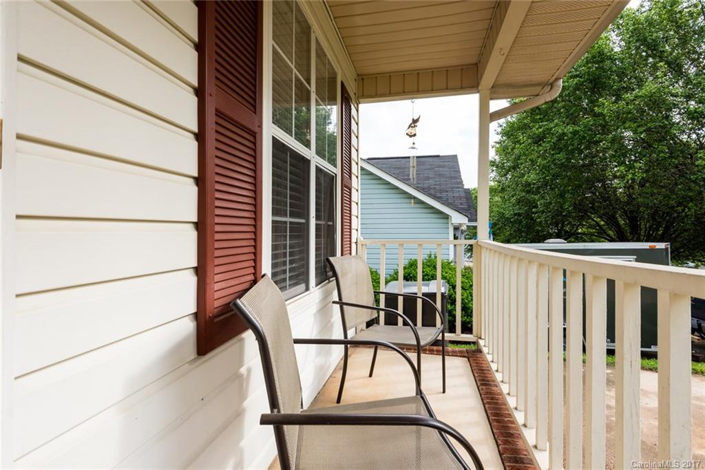 3821 Rosedown Drive Matthews, NC 28105 - Photo 3 of 19 a view of patio with a table and chairs and wooden fence