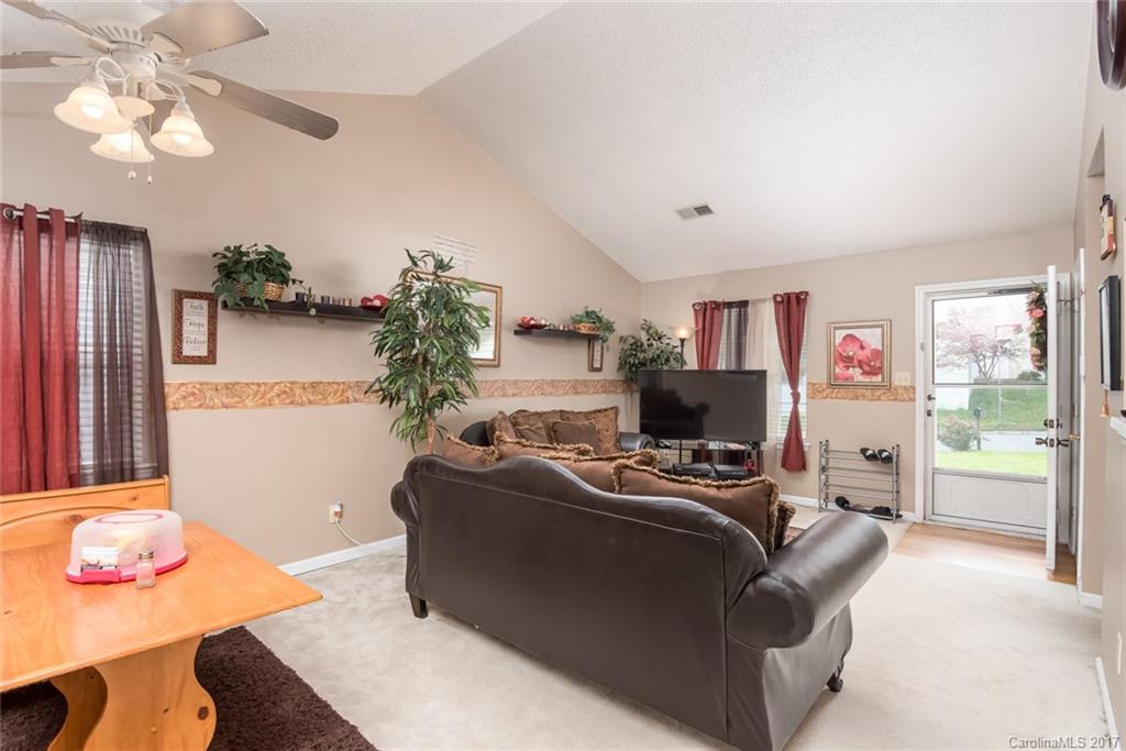 3821 Rosedown Drive Matthews, NC 28105 - Photo 4 of 19 a living room with furniture and a flat screen tv