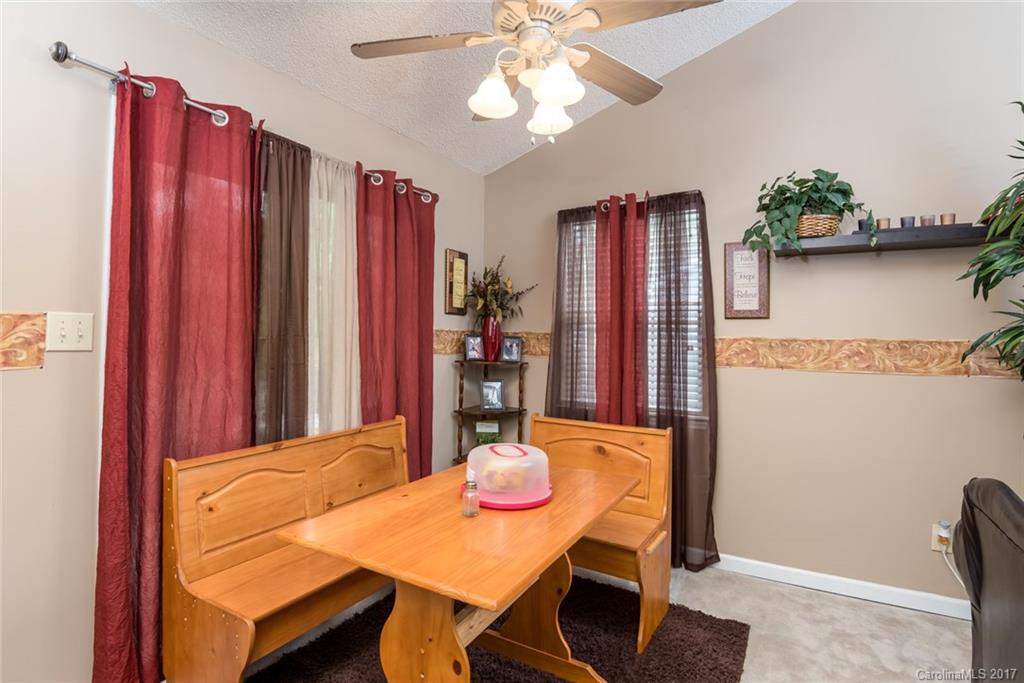 3821 Rosedown Drive Matthews, NC 28105 - Photo 6 of 19 a view of a dining room with furniture and wooden floor