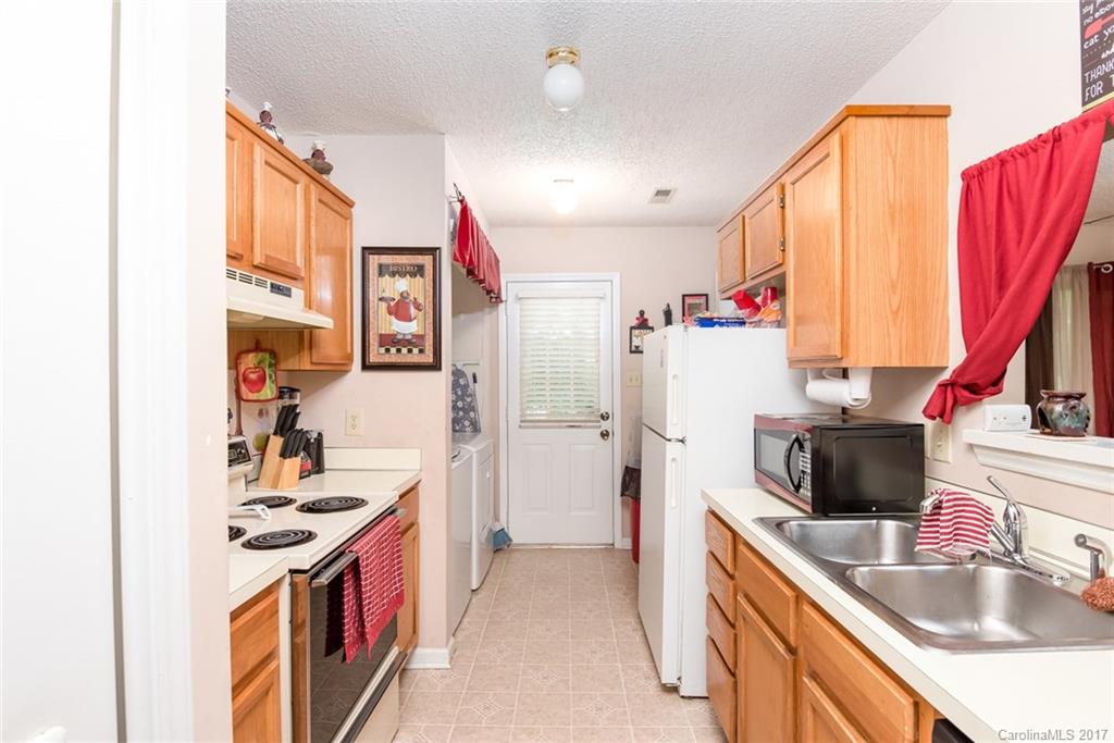 3821 Rosedown Drive Matthews, NC 28105 - Photo 8 of 19 a kitchen with a sink stove and refrigerator