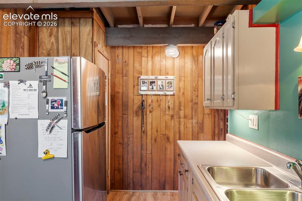 546 Pulver Road Lake George, CO 80827 - Photo 12 of 45 a kitchen with refrigerator and window