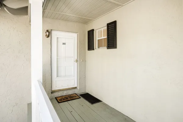 a view of a hallway with washer and dryer