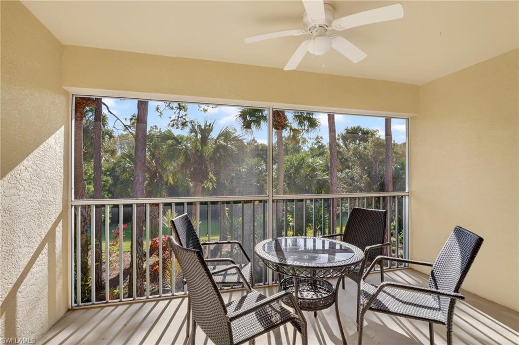 209 Robin Hood Circle, Unit 201 Naples, FL 34104 - Photo 11 of 29 a view of a balcony with chairs
