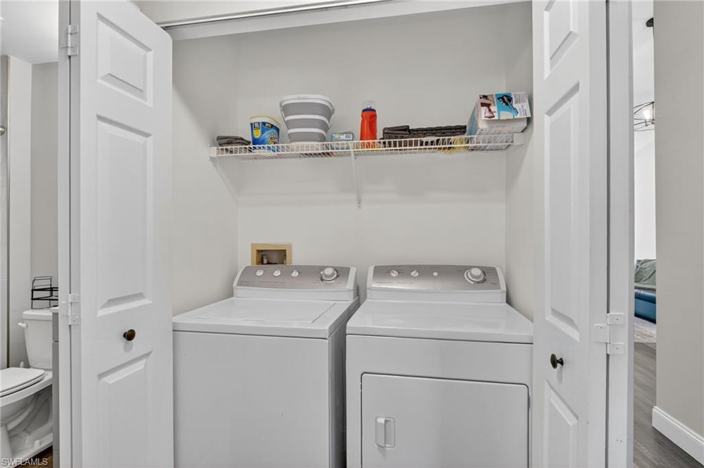 209 Robin Hood Circle, Unit 201 Naples, FL 34104 - Photo 15 of 29 a utility room with dryer and washer